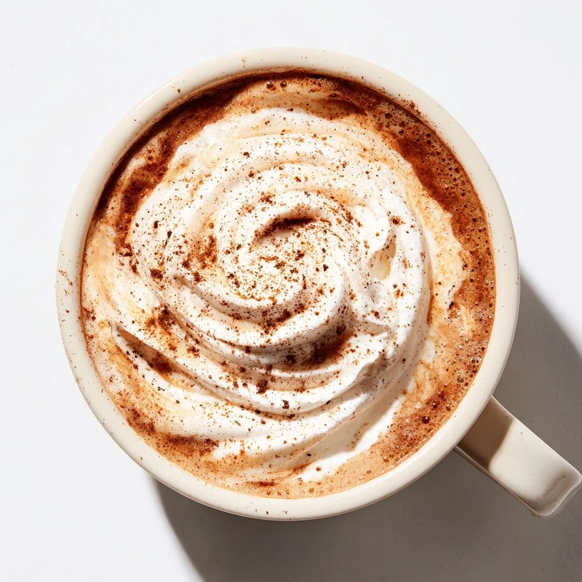 Close-up of a richly flavored spiced coffee, showcasing the blend of fragrant spices in a cup.