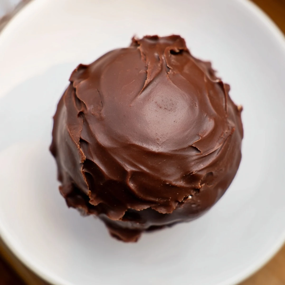Homemade chocolate peanut butter balls: a delightful no-bake dessert ready for serving or snacking.