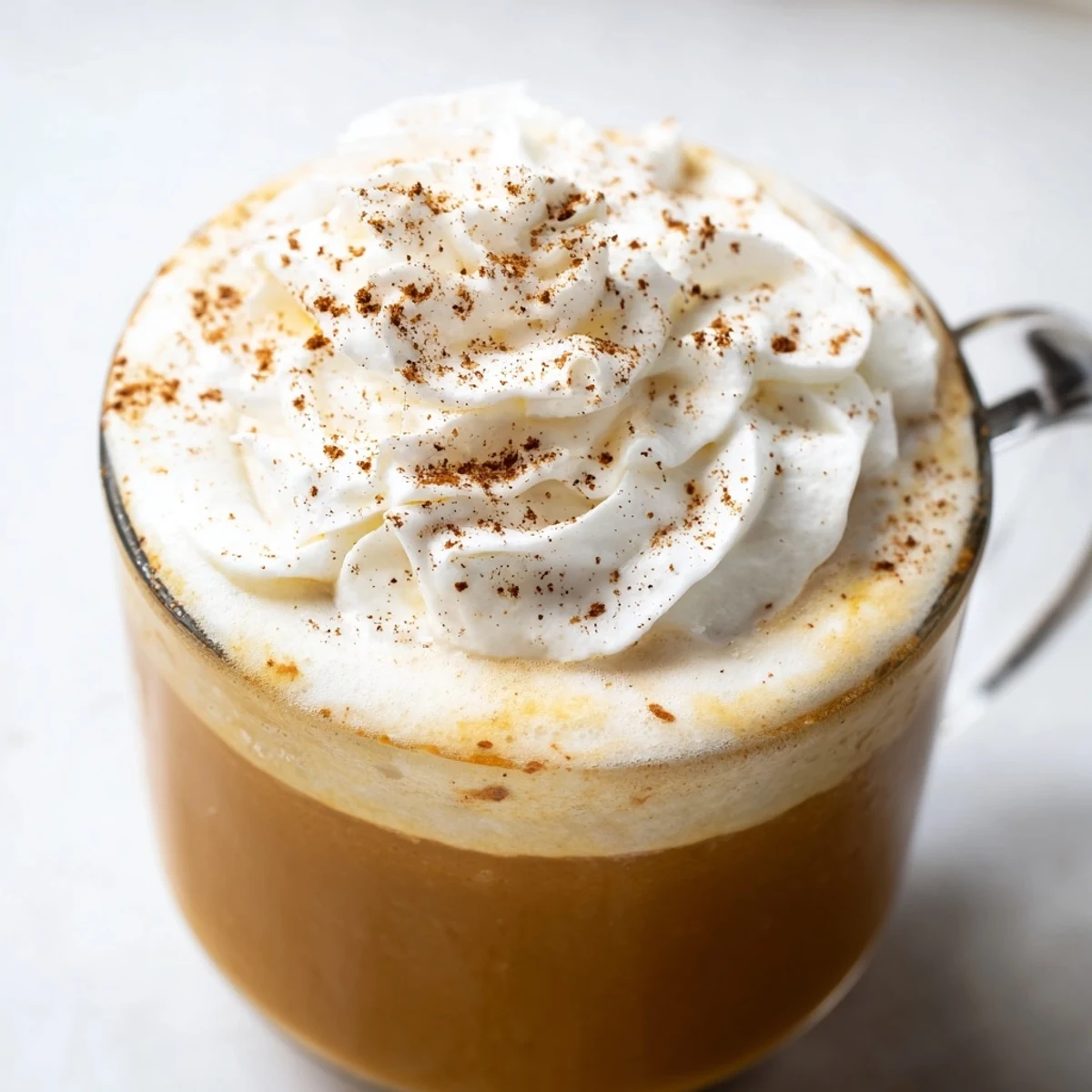 Beautifully frothy Spiced Pumpkin Latte, a warm autumn drink to enjoy on a crisp day.