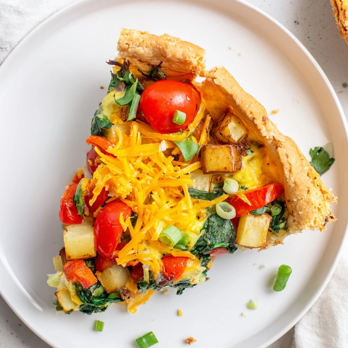 Freshly baked Savory Bacon-Free Egg Pie, featuring flaky crust and a colorful, savory filling, ready to serve.