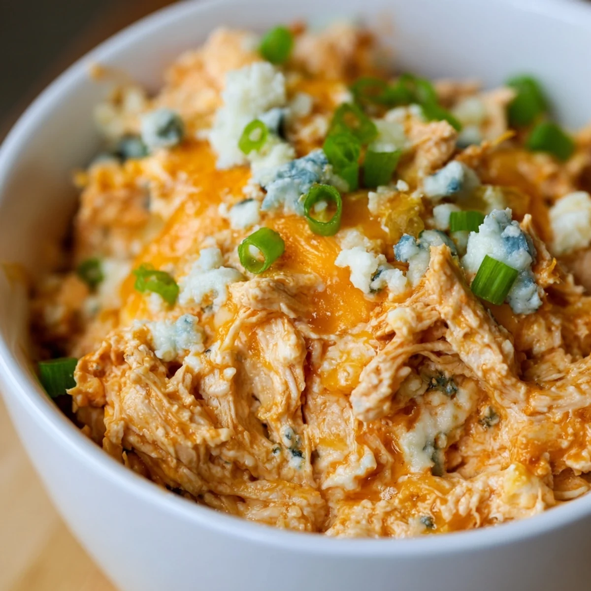 Savory Spicy Buffalo Chicken Dip served warm alongside crunchy celery sticks, a perfect party appetizer for game day.